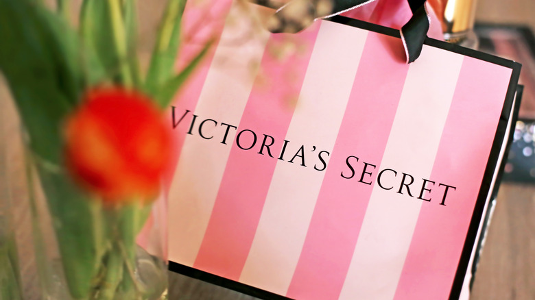 A shopper walks with a Victoria Secret bag in Lennox Mall in