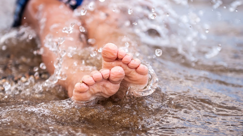 Wrinkled fingers in water