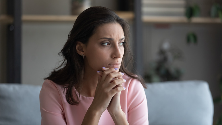 Stressed woman looking to side