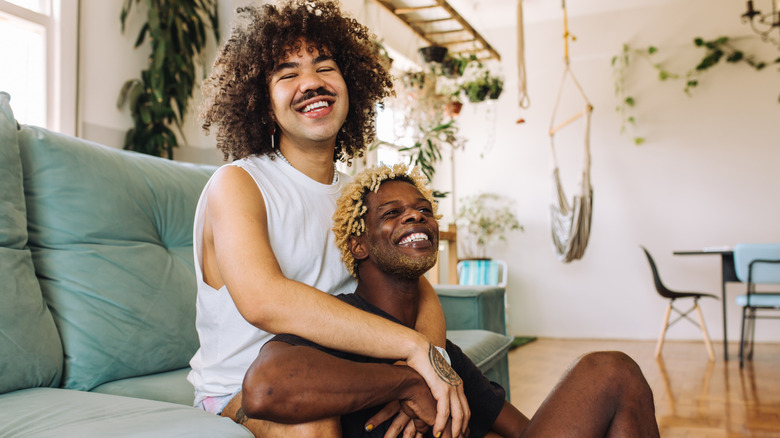 Couple embracing and laughing