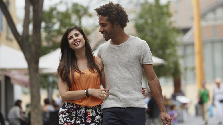 Man and woman walking outside