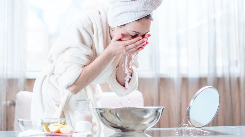 Woman washing her face 