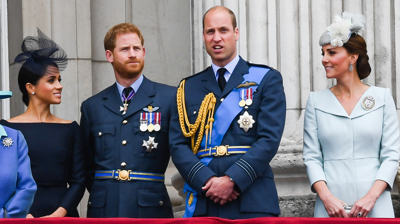 Prince William, Kate Middleton, Meghan Markle, and Prince Harry standing