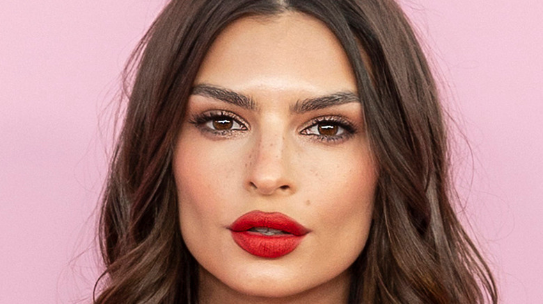 Emily Ratajkowski in a red lip look