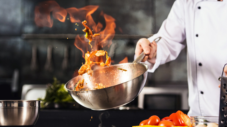 Chef cooking in professional kitchen