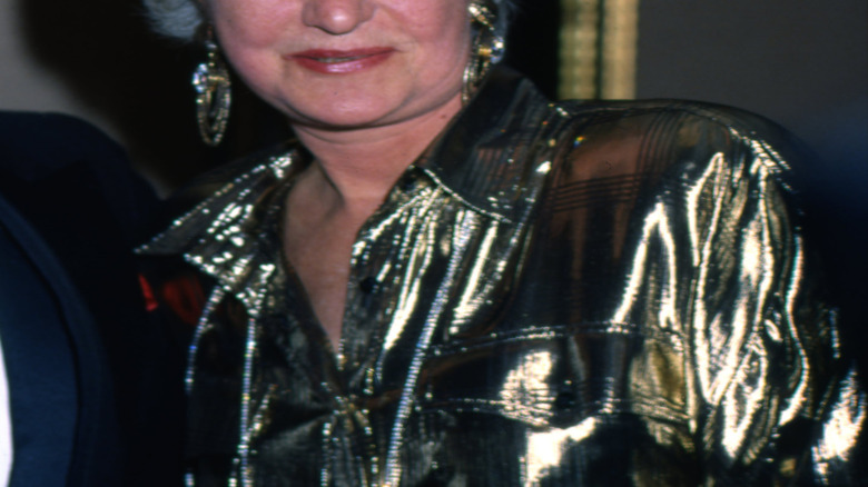 Betty White, Bea Arthur, and Rue McClanahan posing for a photo
