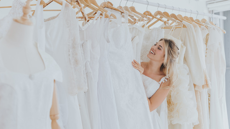 Bride finds her wedding dress hanging on hanger