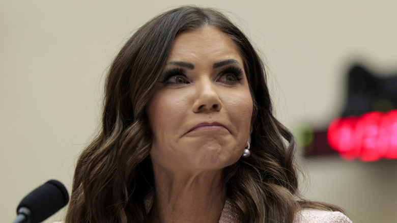 Close-up of Kristi Noem with a fraught expression on her face