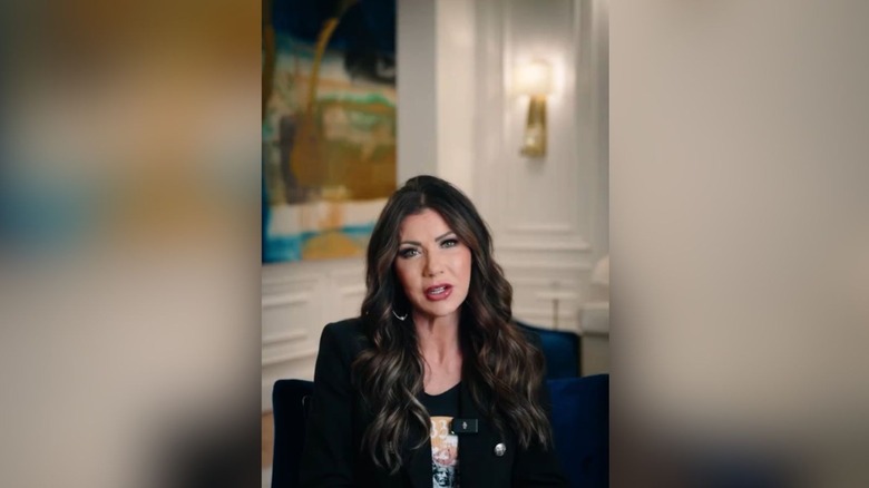 Kristi Noem speaking in a video promoting a cosmetic dentist