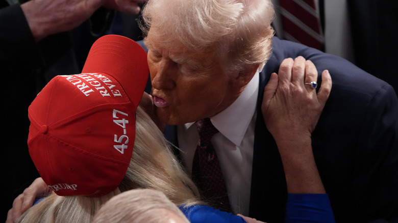 President Trump kissing Marjorie Taylor Greene on the cheek