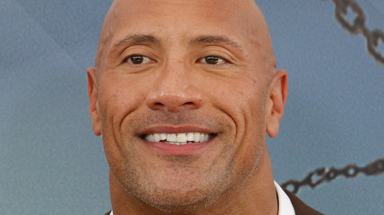 Dwayne Johnson smiling at event 