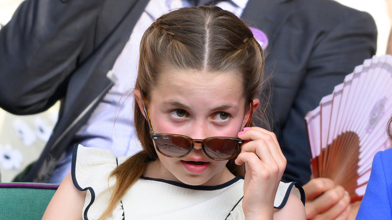 Princess Charlotte looking over her sunglasses at Wimbledon