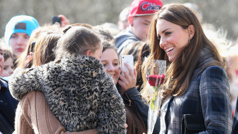 Kate Middleton smiling and talking with fans