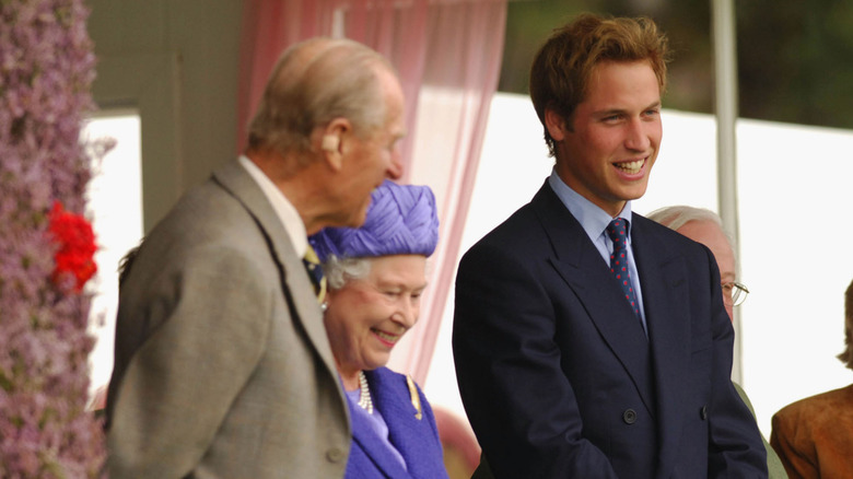 Prince William laughing with Queen Elizabeth and Prince Philip
