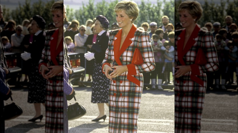 Princess Diana smiling in a tartan suit 