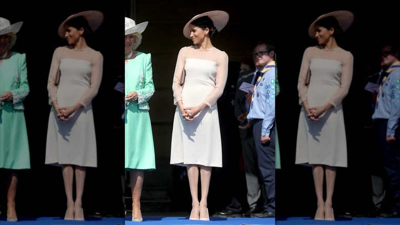 Meghan Markle wearing nude pantyhose next to Camilla Parker Bowles