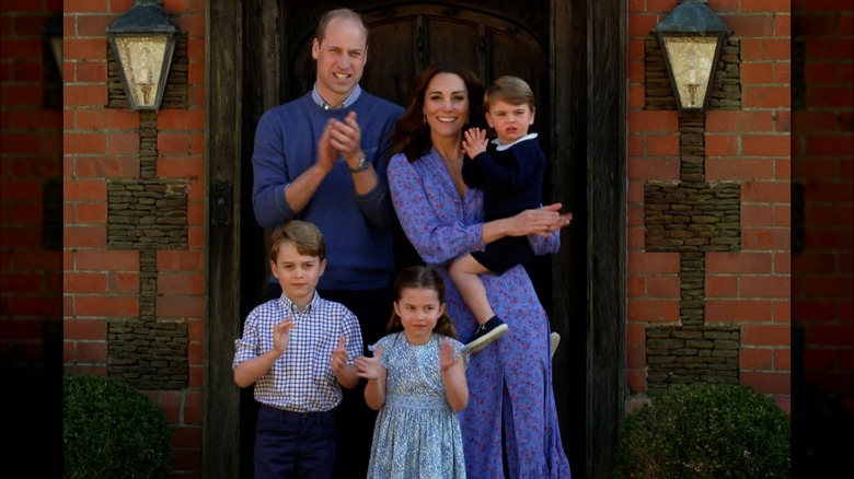 The Wales family wearing coordinated blue outfits