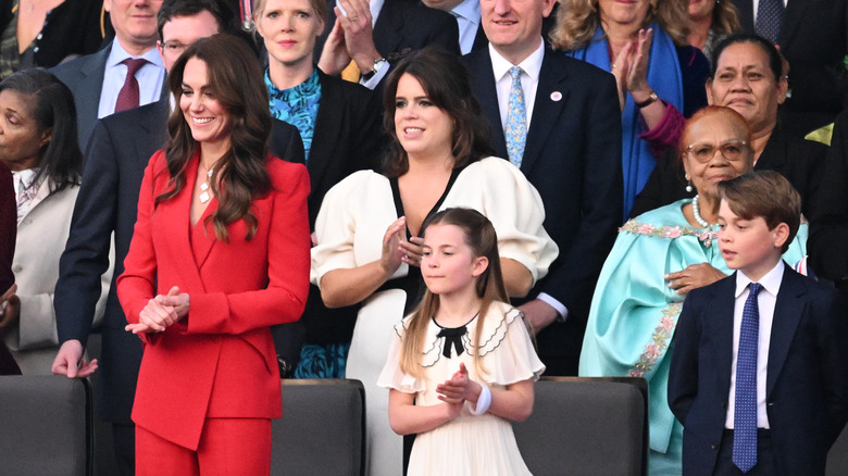 Royal family members, incuding Princess Charlotte, are standing at the Coronation concert