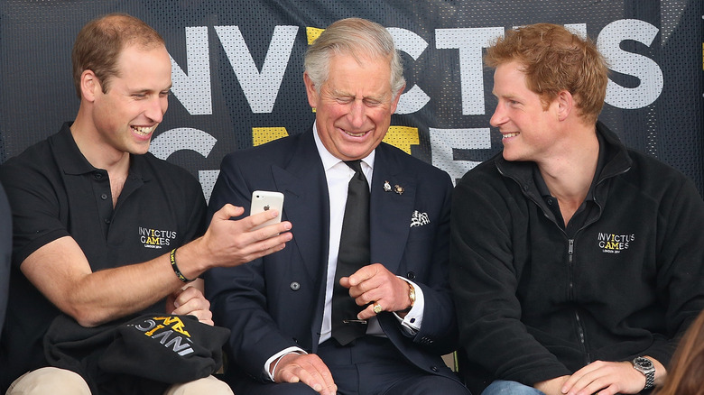 Princes William and Harry laugh with King Charles III