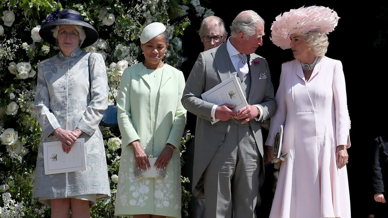 Prince Charles and Camilla whispering at Harry and Meghan's wedding