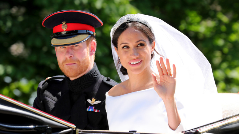 Prince Harry and Meghan Markle in the carriage after their wedding