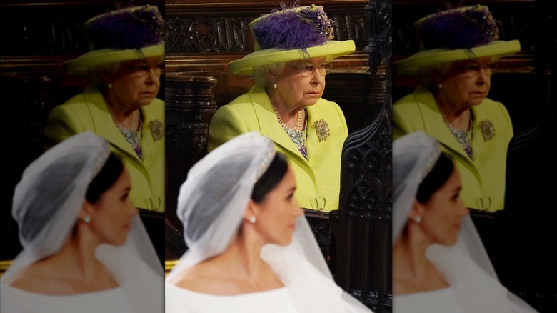 Queen Elizabeth II in a green hat with Meghan Markle in the foreground