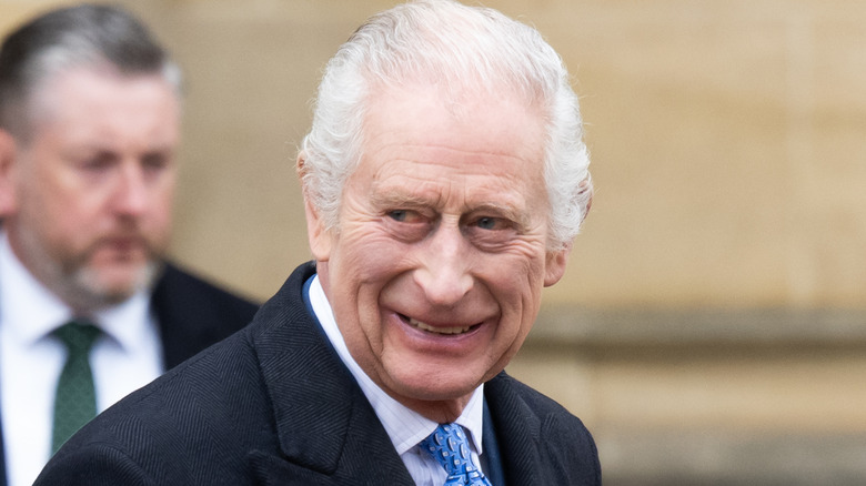 King Charles III smiling 