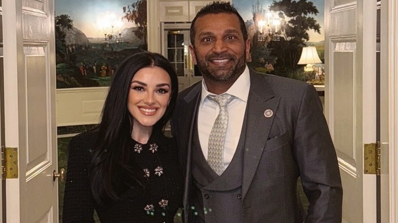 Alexis Wilkins and Kash Patel smiling for a photo