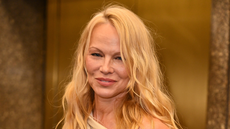 Pamela Anderson smiling, without makeup
