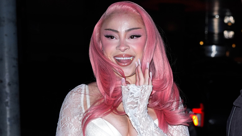 Ice Spice smiling as she waves at the cameras