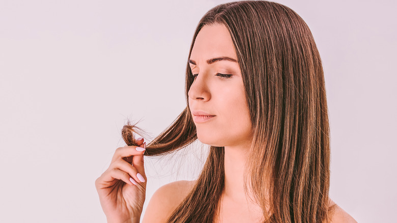 Woman looking at her hair