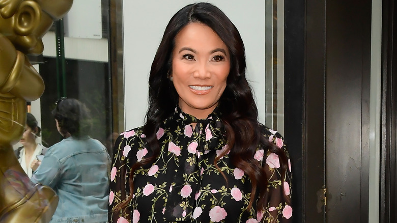 Dr. Sandra Lee smiling in a floral shirt