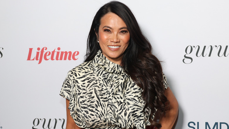 Dr. Sandra Lee smiling in a zebra print dress