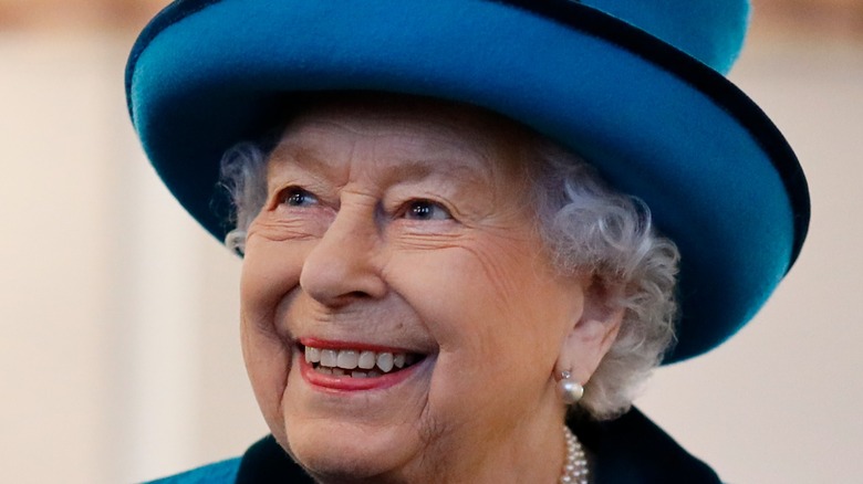 Queen Elizabeth II in blue hat