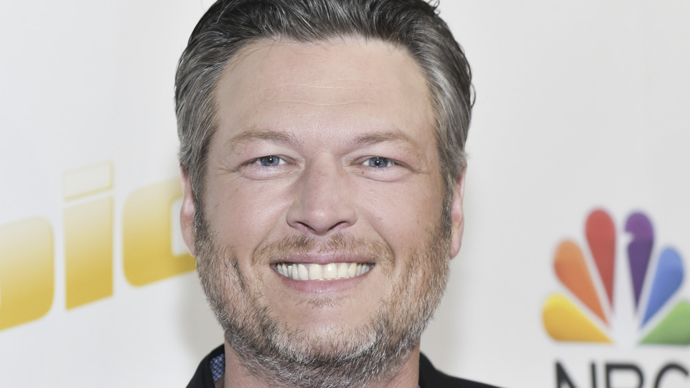 Blake Shelton poising at a The Voice event