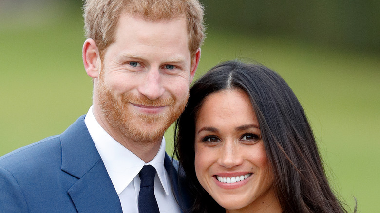 Prince Harry and Meghan Markle smiling