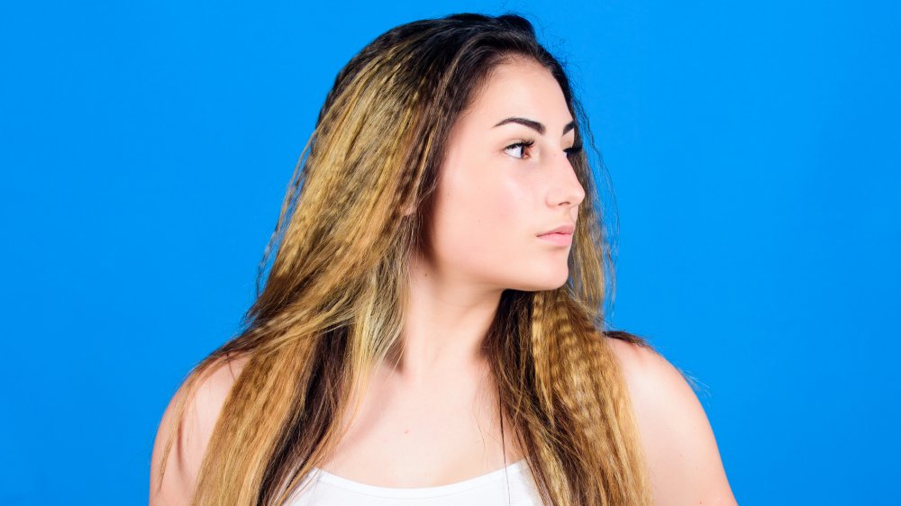 The Secret To Crimping Your Hair With A Straightener