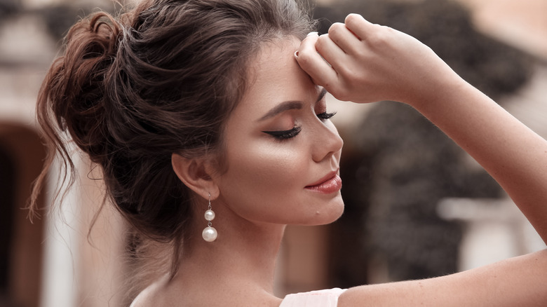 Woman wearing beautiful nude makeup 