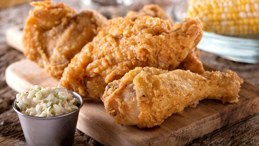 Fried chicken on a wooden platter