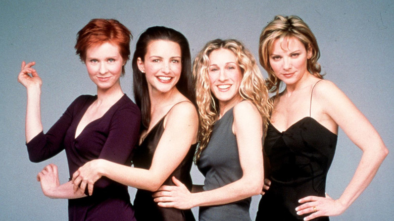 (L-R) Cynthia Nixon, Kristin Davis, Sarah Jessica Parker, and Kim Cattrall posing for a "Sex and the City" photoshoot, 1999