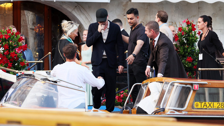 Leonardo DiCaprio hiding his face at Jeff Bezos' 2025 wedding to Lauren Sánchez
