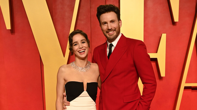 Alba Baptista and Chris Evans smiling