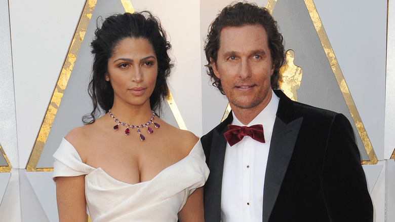 Camila Alves and Matthew McConaughey posing together in formal attire