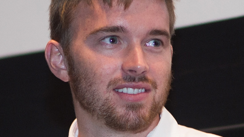 Chandler Massey smiling at an event. 