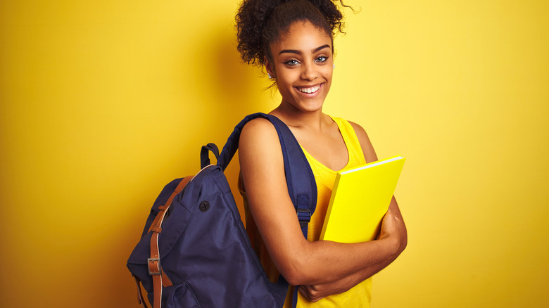 Smiling woman wearing a backpack