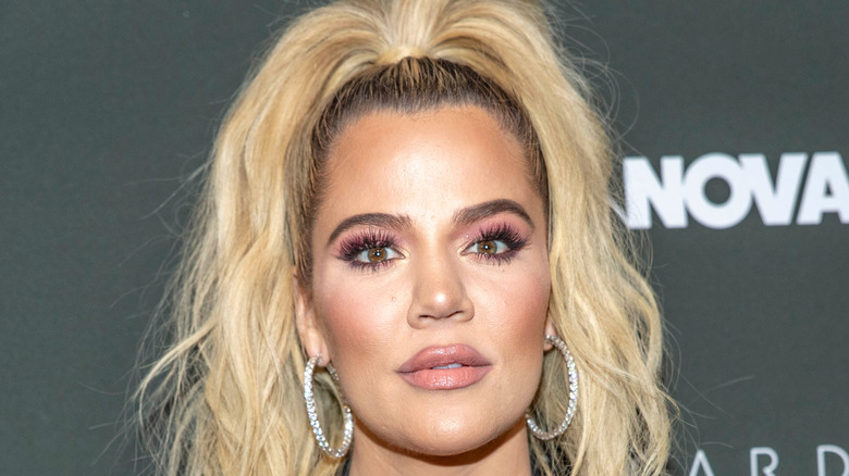 Khloe Kardashian poses on the red carpet