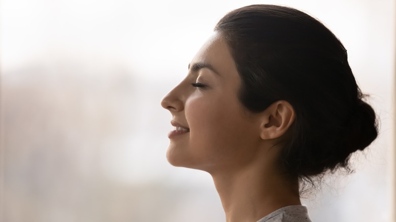 woman meditating happily 