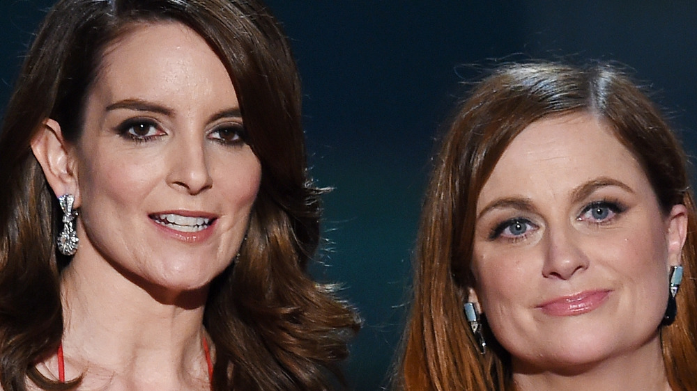 Tina Fey and Amy Poehler present at an awards show