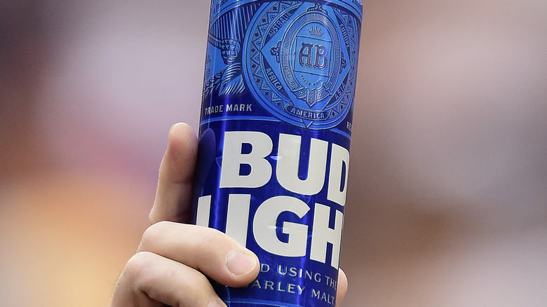 Hand holding Bud Light can