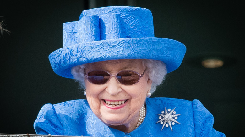 Queen Elizabeth II wearing sunglasses